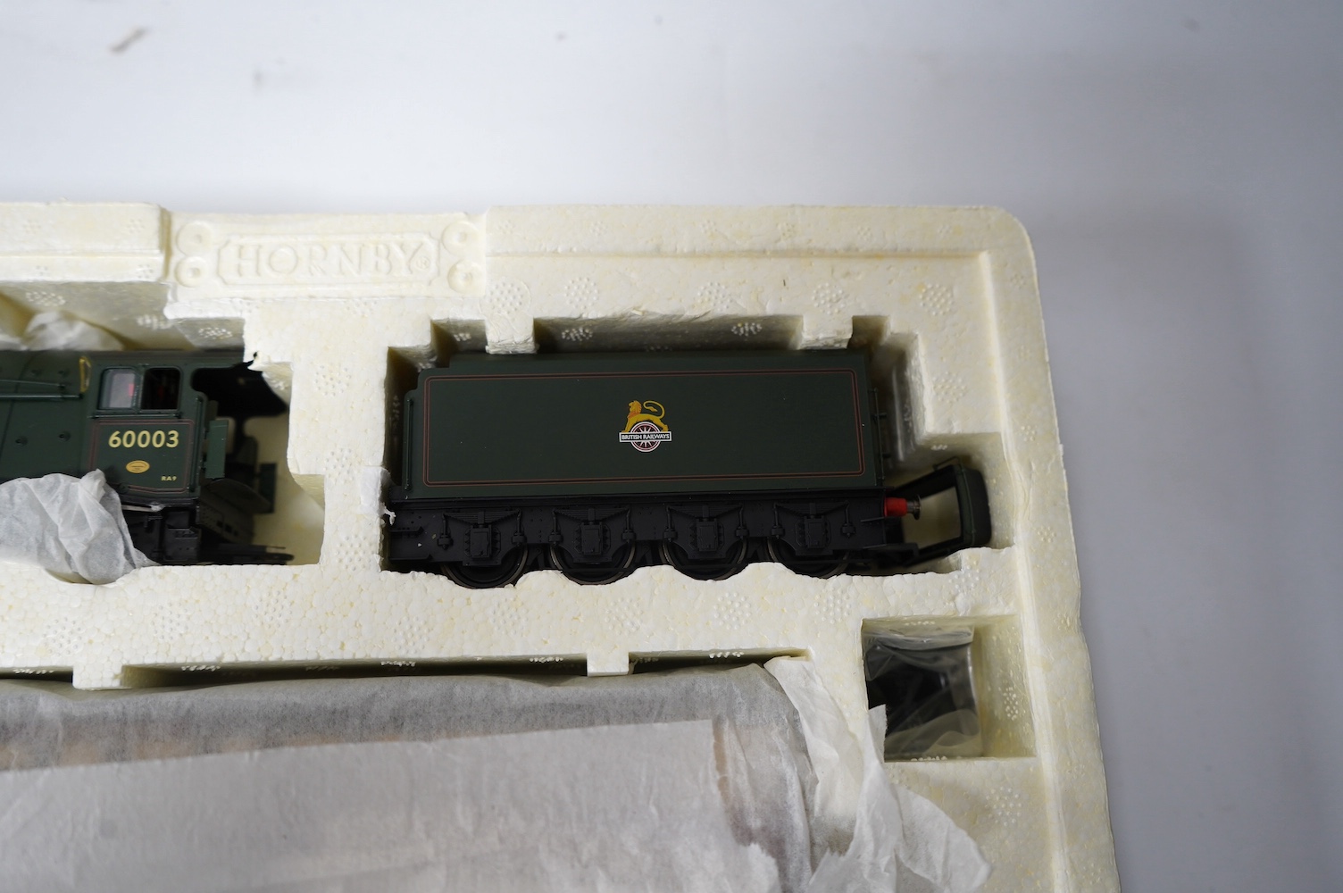 A Hornby Hobbies 00 gauge railway ‘the Northumbrian’ train pack, R2435, together with ‘the Northumbrian Coaches’ coach pack, R4228, comprising of a BR Class A4 locomotive and six maroon and cream coaches. Condition - goo